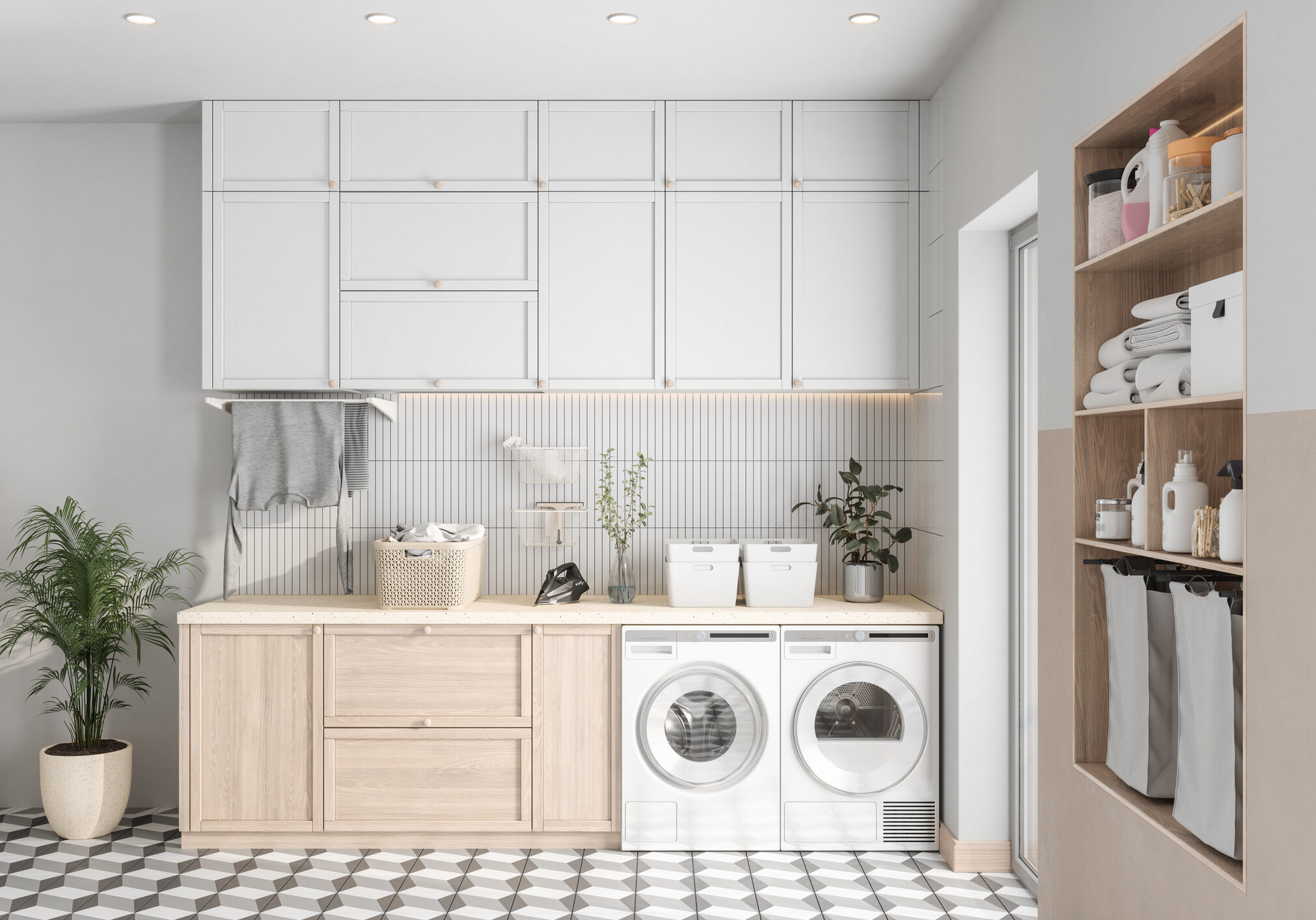 Modern Laundry Room With Washing Machine, Dryer And Cabinets